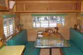 Photo shows woodwork and cabinets in vintage 1949 Star Trailer dining area